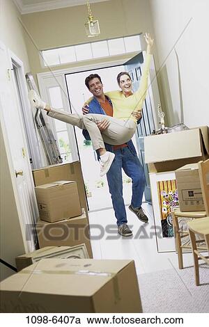 people, home, moving, couple, excitement, excited, carrying View Large Photo Image Stock Image - people, home, moving, couple, excitement, excited, carrying. Fotosearch