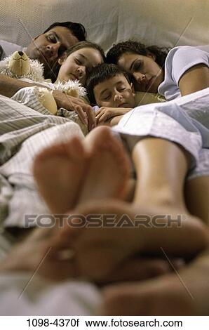 people, home, sleeping, Hispanic, bed, family, asleep View Large Photo Image Stock Image - people, home, sleeping, Hispanic, bed, family, asleep. Fotosearch