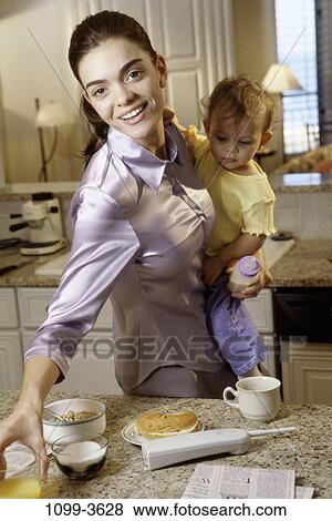 people, home, smiling, mother, breakfast, holding, carrying View Large Photo Image Stock Photo - people, home, smiling, mother, breakfast, holding, carrying. Fotosearch