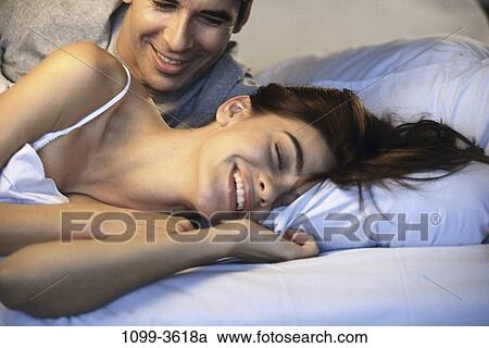 people, home, smiling, talking, couple, pillow View Large Photo Image Stock Image - people, home, smiling, talking, couple, pillow. Fotosearch