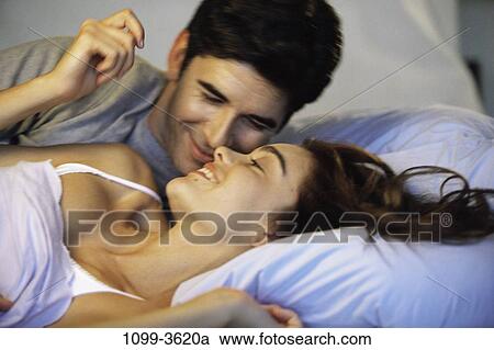 people, home, smiling, talking, couple, pillow View Large Photo Image Stock Image - people, home, smiling, talking, couple, pillow. Fotosearch