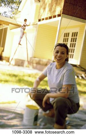 people, home, woman, painting, ladder, outdoors, house View Large Photo Image Stock Photo - people, home, woman, painting, ladder, outdoors, house. Fotosearch