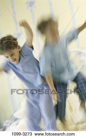 Stock Image - people, jump, jumping, bed, motion, bouncing, children. Fotosearch