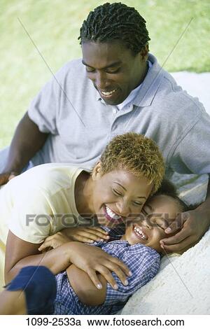 people, laughing, playful, outdoors, nurturing, Middle-aged, hugging View Large Photo Image Stock Image - people, laughing, playful, outdoors, nurturing, Middle-aged, hugging. Fotosearch