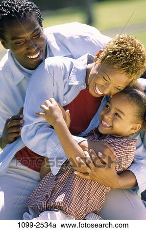 people, laughing, playful, outdoors, nurturing, Middle-aged, hugging View Large Photo Image Stock Image - people, laughing, playful, outdoors, nurturing, Middle-aged, hugging. Fotosearch