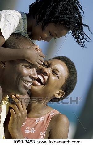 people, laughing, riding, outdoors, carrying, family, clasping View Large Photo Image Stock Image - people, laughing, riding, outdoors, carrying, family, clasping. Fotosearch