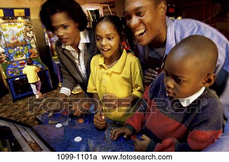 people, lifestyles, challenges, achievement, arcade, teamwork, outings View Large Photo Image Stock Image - people, lifestyles, challenges, achievement, arcade, teamwork, outings. Fotosearch