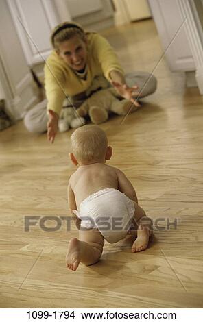 people, mother, baby, family, beginnings, blond, crawling View Large Photo Image Picture - people, mother, baby, family, beginnings, blond, crawling. Fotosearch