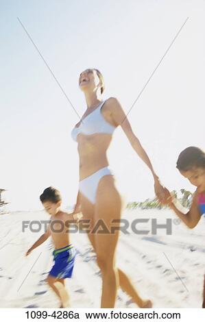 Stock Image - people, mother, beach, joyous, family, bikini, joy. Fotosearch