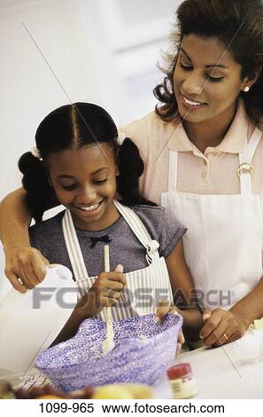 people, mother, cooking, smile, family, apron, daughter View Large Photo Image Stock Photography - people, mother, cooking, smile, family, apron, daughter. Fotosearch