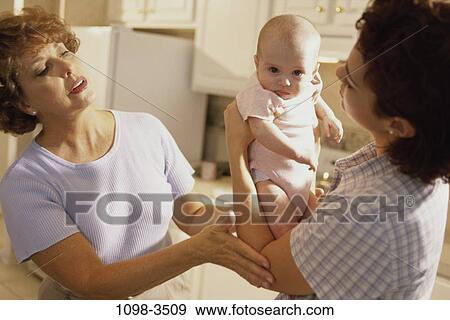 Stock Photo - people, mother, Hispanic, holding, three, lifting. Fotosearch