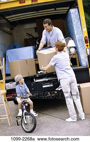people, moving, pack, cardboard, outdoors, endings, lifting View Large Photo Image Stock Image - people, moving, pack, cardboard, outdoors, endings, lifting. Fotosearch