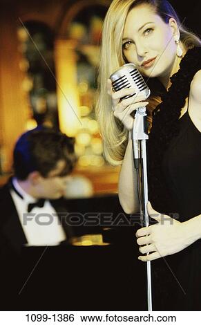 Stock Photograph - people, music, piano, arts, entertainment, singing. Fotosearch