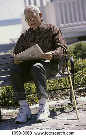 people, newspaper, eyeglasses, bench, sitting, senior View Large Photo Image Stock Photo - people, newspaper, eyeglasses, bench, sitting, senior. Fotosearch