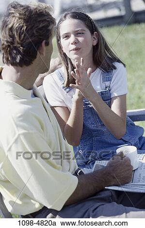 people, newspaper, talking, conversation, bench, holding, pleading View Large Photo Image Stock Image - people, newspaper, talking, conversation, bench, holding, pleading. Fotosearch