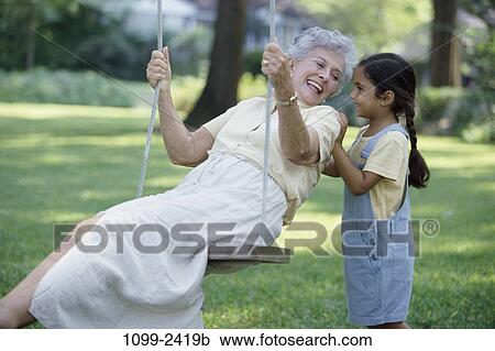people, outdoors, family, grandchild, grandparent, grandkid, Grandparents outdoors View Large Photo Image Stock Image - people, outdoors, family, grandchild, grandparent, grandkid, Grandparents outdoors. Fotosearch