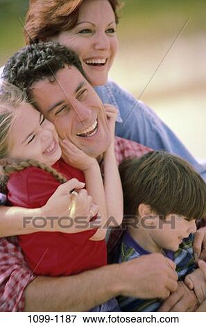 people, outdoors, joyous, family, close, portrait, closeness View Large Photo Image Stock Photo - people, outdoors, joyous, family, close, portrait, closeness. Fotosearch