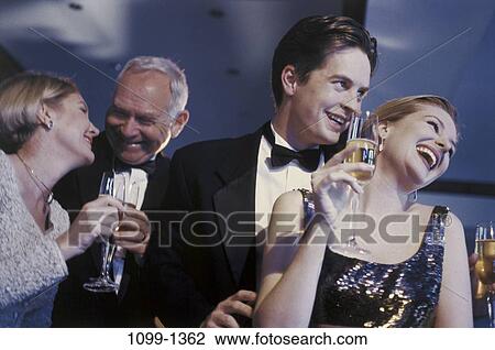 Stock Image - people, party, glasses, celebration, champagne, holding, festive. Fotosearch