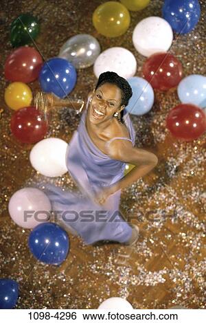 Stock Photograph - people, party, woman, formal, celebration, balloons, dancing. Fotosearch
