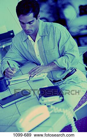 Stock Photo - people, planner, Hispanic, lifestyles, writing, planning. Fotosearch