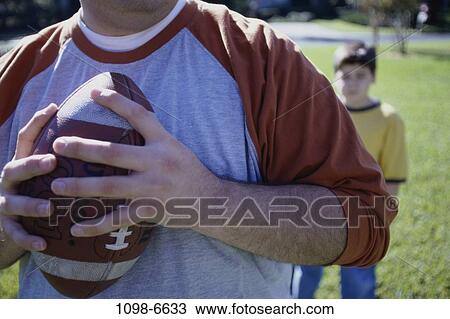 people, playing, ball, football, outdoors, family View Large Photo Image Stock Image - people, playing, ball, football, outdoors, family. Fotosearch