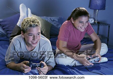 people, playing, bed, entertainment, television, play View Large Photo Image Stock Image - people, playing, bed, entertainment, television, play. Fotosearch