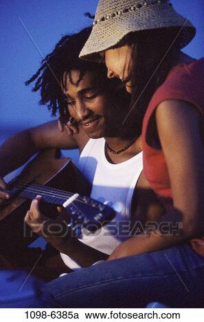 people, playing, couple, music, guitar, outdoors, play View Large Photo Image Stock Image - people, playing, couple, music, guitar, outdoors, play. Fotosearch