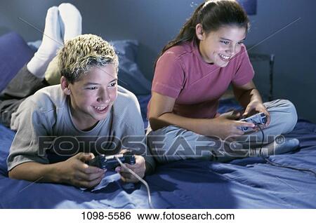 people, playing, entertainment, television, play, game View Large Photo Image Stock Photograph - people, playing, entertainment, television, play, game. Fotosearch