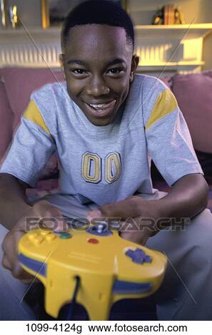 people, playing, tongue, boy, entertainment, television, controller View Large Photo Image Stock Image - people, playing, tongue, boy, entertainment, television, controller. Fotosearch