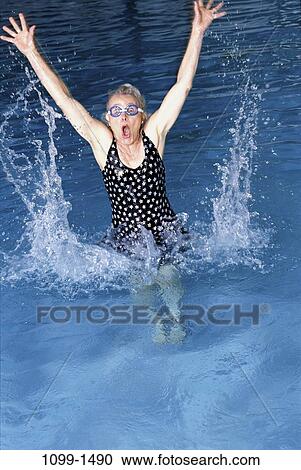 people, pool, woman, jump, jumping, senior, bathing suit View Large Photo Image Stock Image - people, pool, woman, jump, jumping, senior, bathing suit. Fotosearch