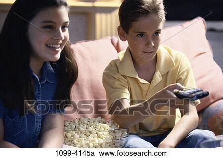 people, popcorn, watch, couch, watching, television, children View Large Photo Image Stock Image - people, popcorn, watch, couch, watching, television, children. Fotosearch