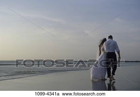 people, reflection, water, walking, couple, beach View Large Photo Image Stock Image - people, reflection, water, walking, couple, beach. Fotosearch