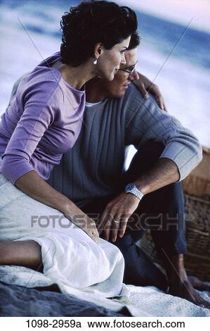 people, relaxation, couple, picnic, beach, romantic, tranquility View Large Photo Image Stock Image - people, relaxation, couple, picnic, beach, romantic, tranquility. Fotosearch