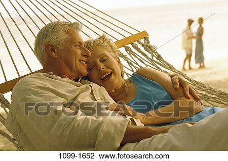 people, relaxation, couple, senior, beach, laughing, hammock View Large Photo Image Stock Image - people, relaxation, couple, senior, beach, laughing, hammock. Fotosearch