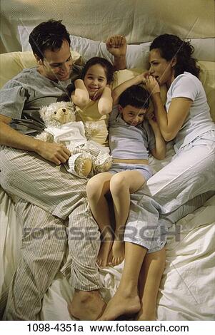 people, relaxation, Hispanic, bed, relaxing, commitment, family View Large Photo Image Stock Image - people, relaxation, Hispanic, bed, relaxing, commitment, family. Fotosearch