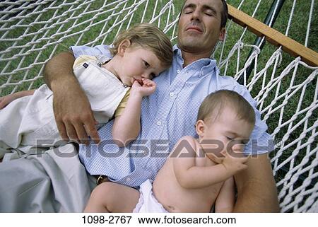 people, relaxation, sleeping, hammock, outdoors, relaxing, family View Large Photo Image Stock Photo - people, relaxation, sleeping, hammock, outdoors, relaxing, family. Fotosearch