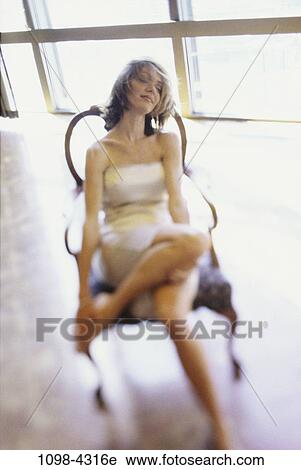 people, relaxation, woman, relaxing, feet, tired, brunette View Large Photo Image Stock Image - people, relaxation, woman, relaxing, feet, tired, brunette. Fotosearch