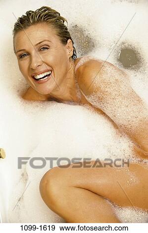 people, relaxation, woman, smiling, bubbles, Middle-aged, relaxing View Large Photo Image Stock Photo - people, relaxation, woman, smiling, bubbles, Middle-aged, relaxing. Fotosearch