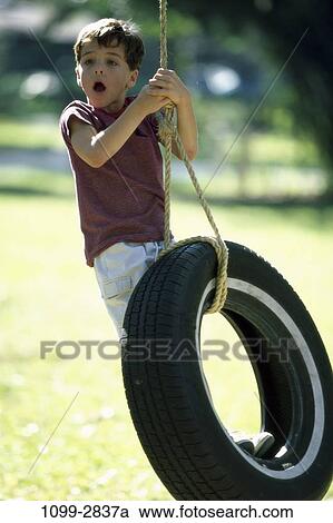 people, rope, playing, hanging, swinging, holding, swing View Large Photo Image Stock Image - people, rope, playing, hanging, swinging, holding, swing. Fotosearch
