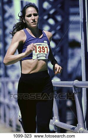 people, running, woman, racing, outdoors, sports, brunette View Large Photo Image Stock Image - people, running, woman, racing, outdoors, sports, brunette. Fotosearch