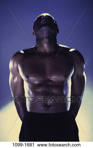 Stock Image - people, shadows, strength, posing, pinup, torso. Fotosearch