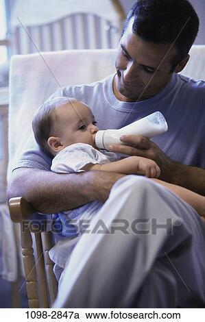 people, sitting, baby, calm, holding, nurturing, family View Large Photo Image Stock Image - people, sitting, baby, calm, holding, nurturing, family. Fotosearch