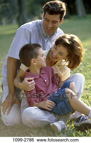 people, sitting, playful, outdoors, nurturing, family View Large Photo Image Stock Photograph - people, sitting, playful, outdoors, nurturing, family. Fotosearch