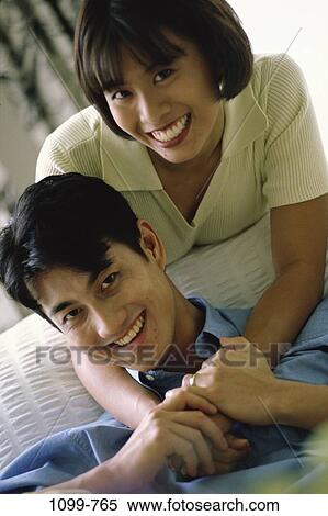 people, smiling, Asian, couple, curtain, happy, couch View Large Photo Image Stock Photography - people, smiling, Asian, couple, curtain, happy, couch. Fotosearch
