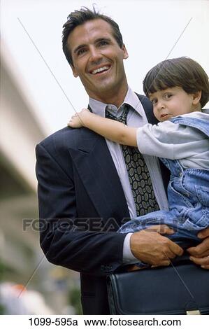 people, smiling, briefcase, suit, outdoors, carrying, family View Large Photo Image Stock Image - people, smiling, briefcase, suit, outdoors, carrying, family. Fotosearch