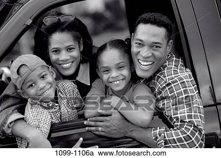Stock Image - people, smiling, car, laughing, outdoors, family, outing. Fotosearch