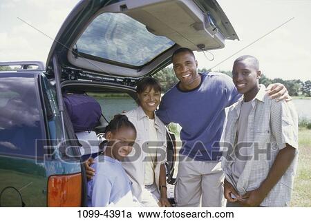 people, smiling, car, pack, luggage, outdoors View Large Photo Image Stock Image - people, smiling, car, pack, luggage, outdoors. Fotosearch