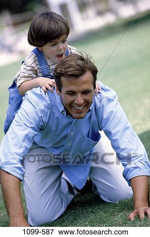 people, smiling, climbing, playful, outdoors, family View Large Photo Image Stock Photo - people, smiling, climbing, playful, outdoors, family. Fotosearch