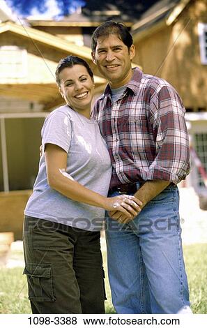 people, smiling, couple, Hispanic, happy, outdoors, hugging View Large Photo Image Stock Photo - people, smiling, couple, Hispanic, happy, outdoors, hugging. Fotosearch
