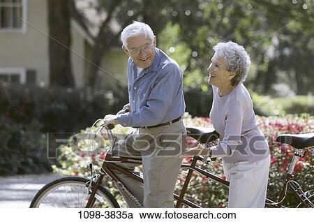people, smiling, couple, senior, bicycle, outdoors View Large Photo Image Stock Image - people, smiling, couple, senior, bicycle, outdoors. Fotosearch